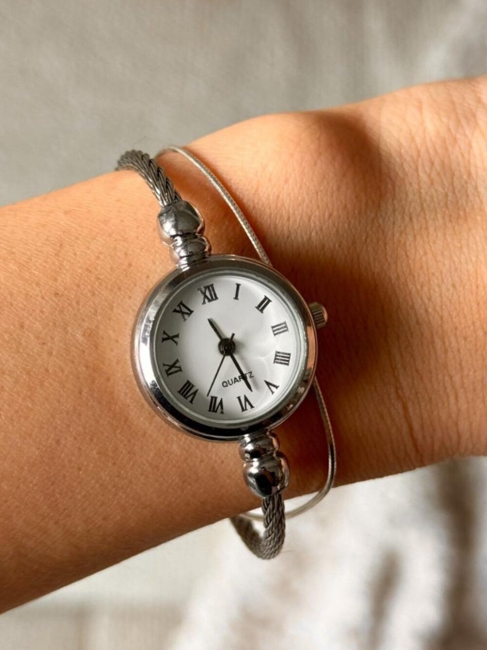 Silver Cable Cuff Watch Roman Numeral Dial Minimalist Elegant